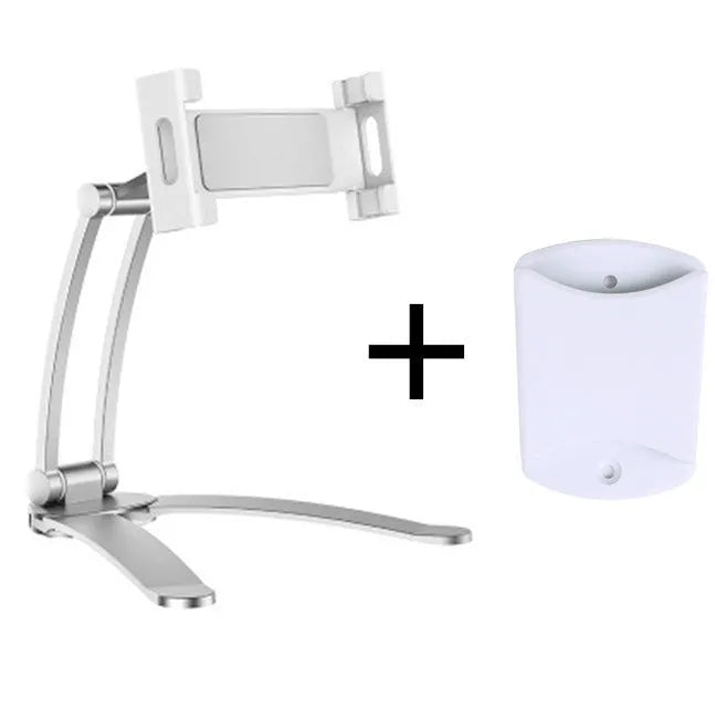 Silver aluminium desktop stand holding a tablet, showing 360-degree rotation and adjustable clamp mechanism.