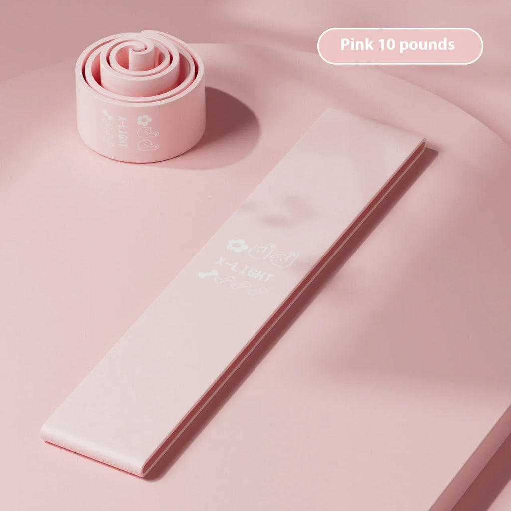 Plastic elastic resistance band in four colours: green, beige, orange, and pink representing different tension levels