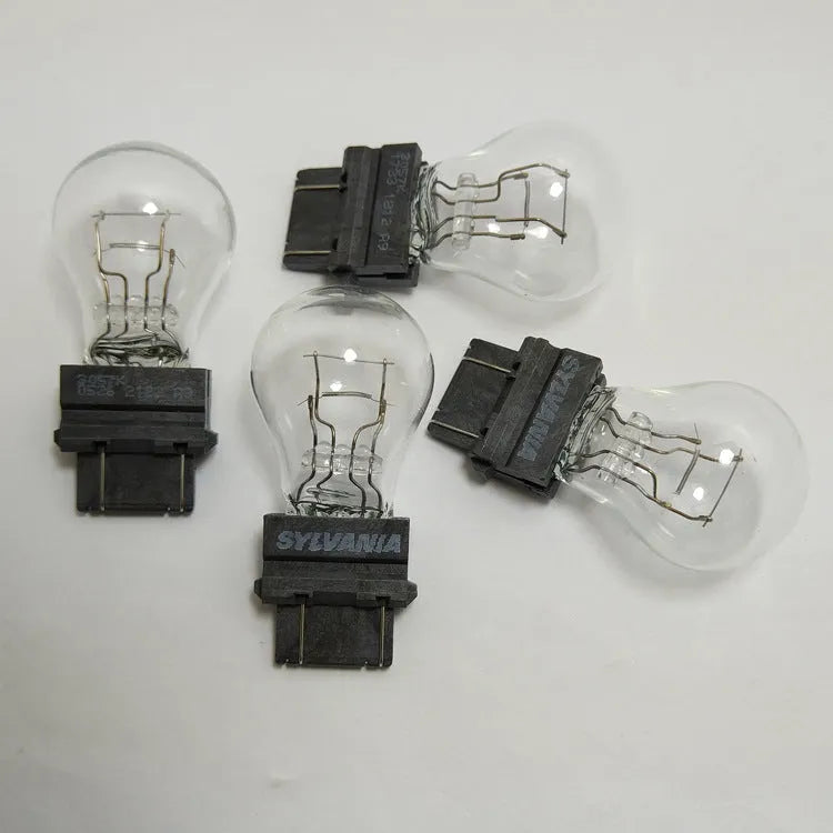 Wagner brake light bulb with dual wire design showing plastic alignment dots and 16mm socket