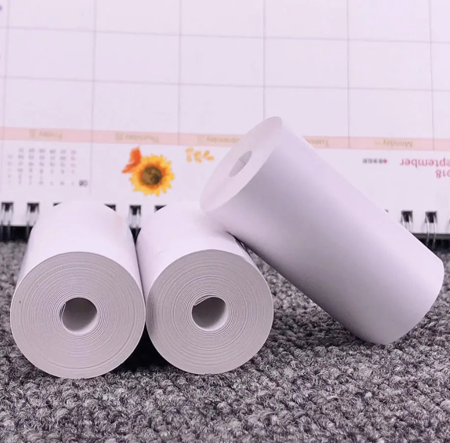 PerPage mini wireless portable thermal printer paper roll in multiple colours, showing label and sticker options