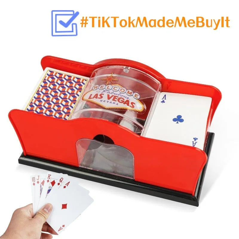 Black manual card shuffling machine with hand crank on wooden table