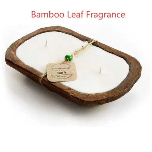 Lavender-scented soy wax candle in a wooden basin with a wooden wick