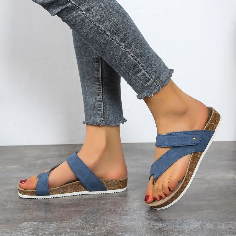 Flat toe ring flip-flops with a thick foam sole in a solid blue colour on a white background.