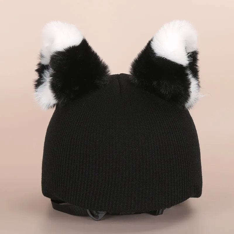 A soft plush cartoon character cover stretched over a medium-sized motorcycle helmet.