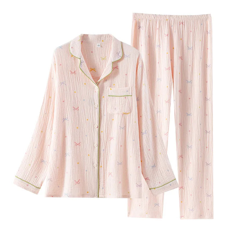 Women's cotton pajamas set in pink and beige colours showing long sleeves and trousers-length pants