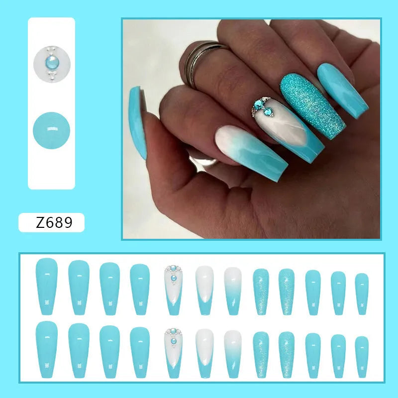 Long ballet shaped press-on nails with solid blue diamond glitter colour.