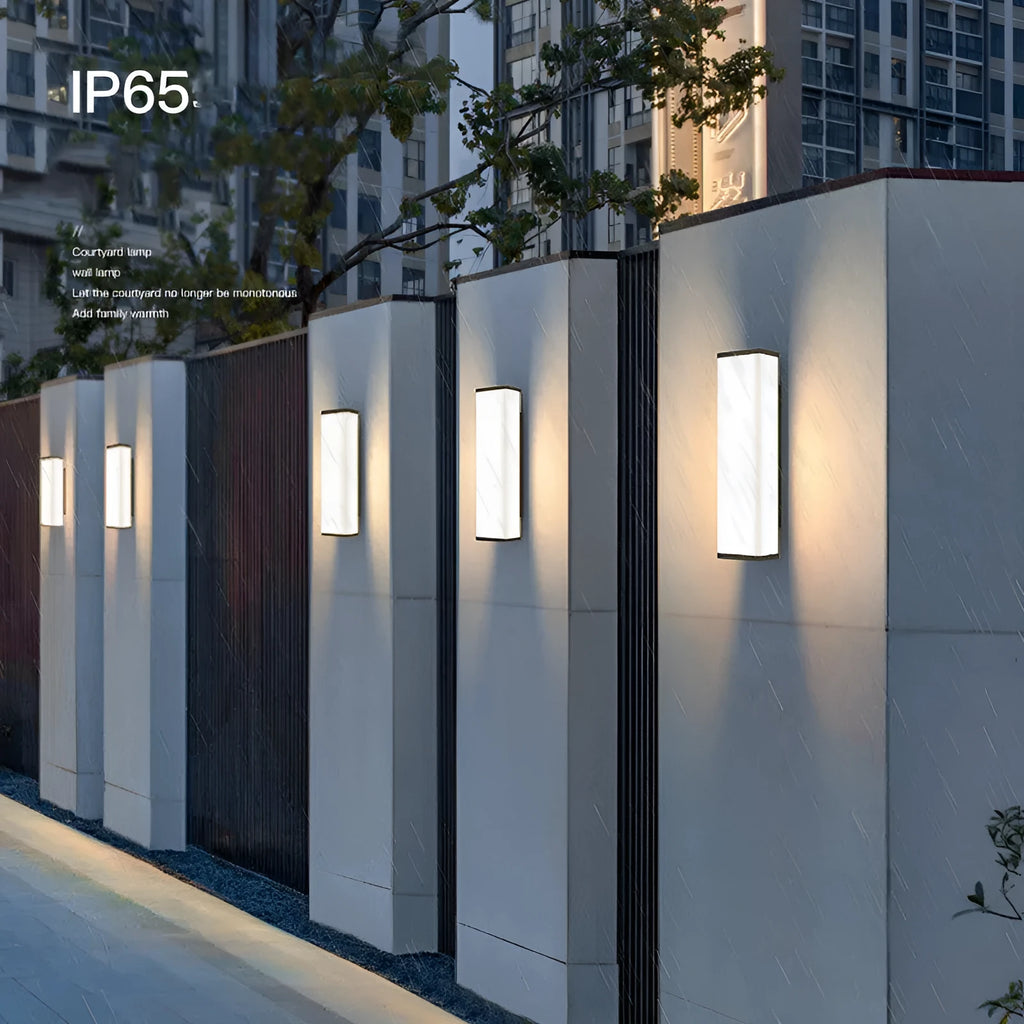 Stainless steel long strip outdoor wall light with LED, mounted on an exterior wall.