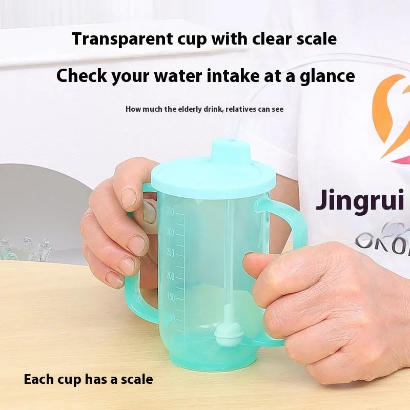 A white PP plastic choke-proof drinking cup with an angled spout, handle, and lid, shown on a bedside table.
