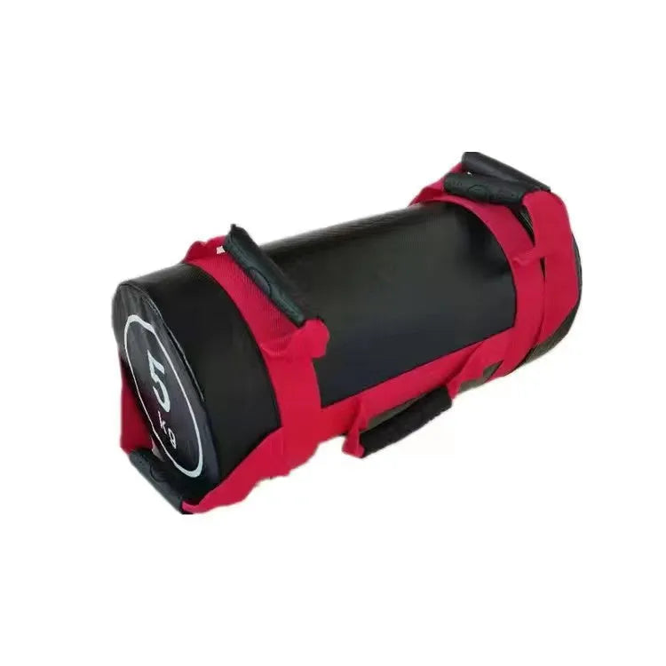 Flat white leather PVC fitness sandbag for weight training on a gym floor.