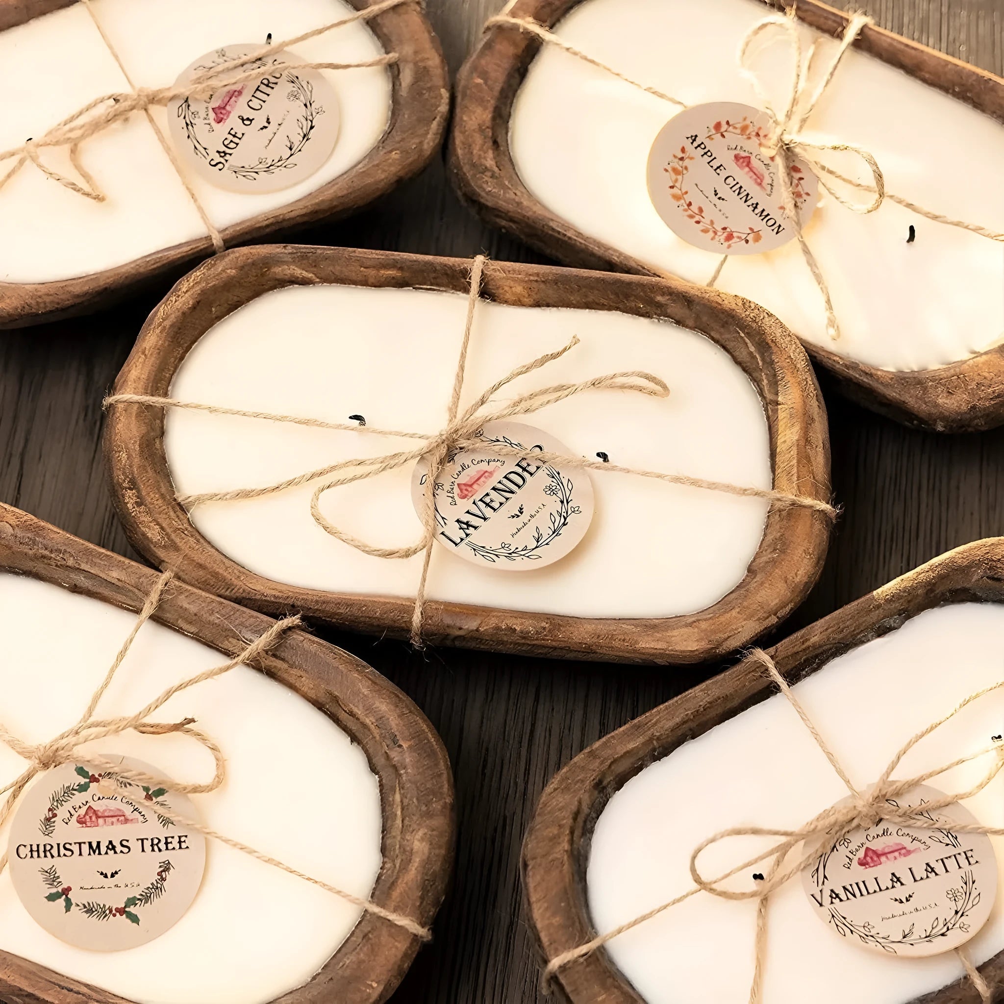Lavender-scented soy wax candle in a wooden basin with a wooden wick