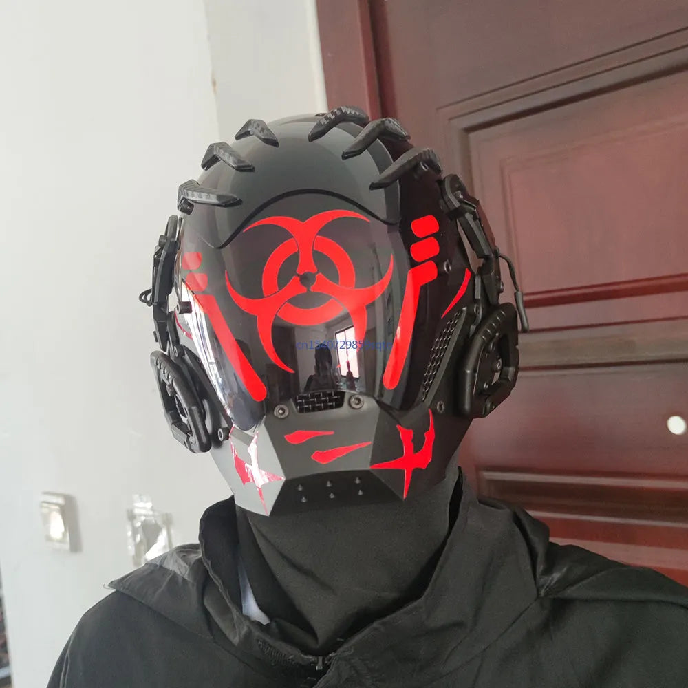Black angular full-face tech helmet mask on a white background, showing sculpted details.