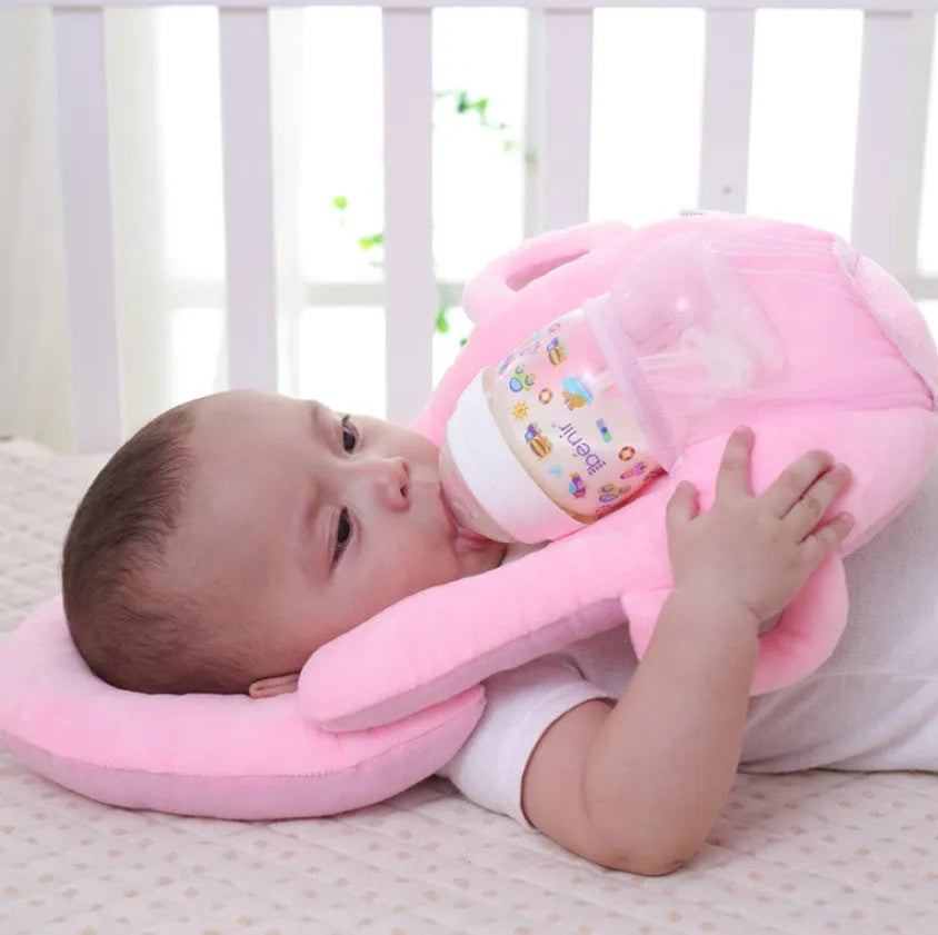 Plush confinement baby feeding pillow in soft colours, measuring 30cm by 42cm.