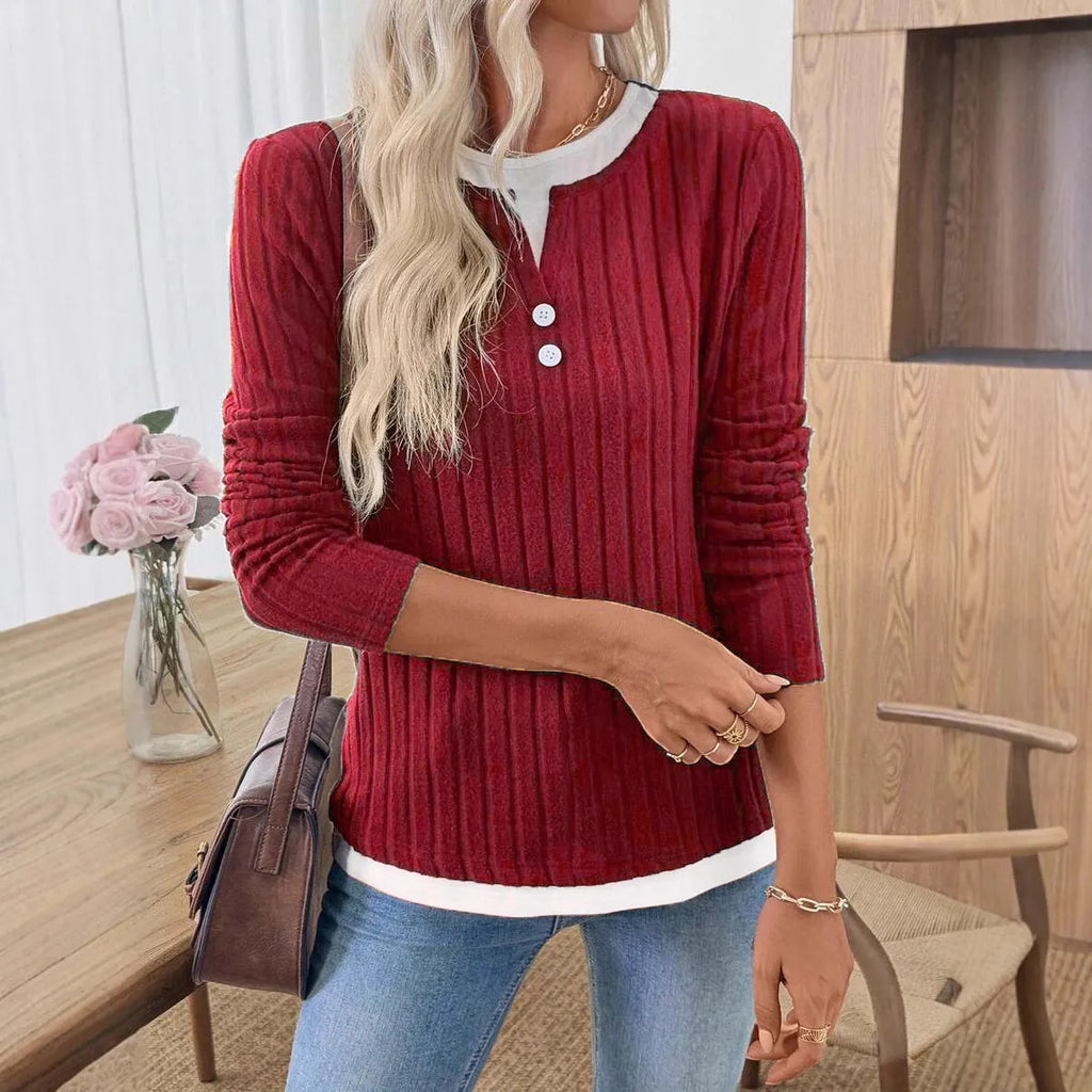 Women's black concave stripe fake two-piece pullover sweater with long sleeves and round neck.