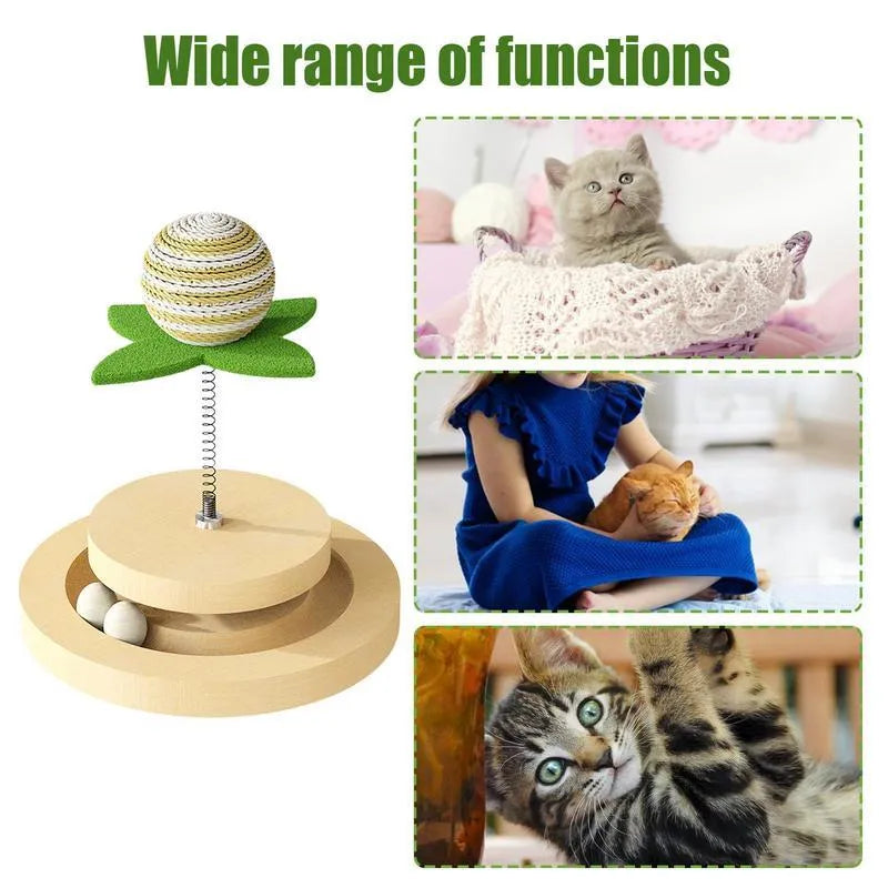 Green cat toy with a sisal scratching centre and a circular plastic ball track on a turntable.