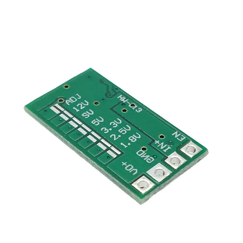 Green PCB mini DC-DC step down power supply module converting 12-24V to 5V 3A.