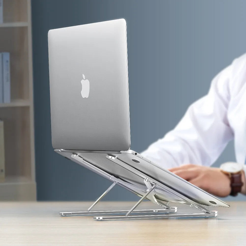 Aluminium foldable laptop stand in silver colour, shown open at an angle and folded flat.
