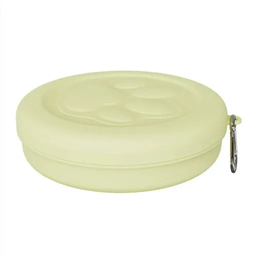 Collapsible silicone dog bowl shown in light pink and green colours, compressed flat and expanded for use.