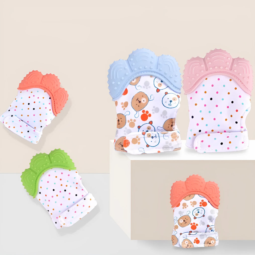 BPA-free silicone baby teether glove fastened with a white Velcro strap on a baby's hand