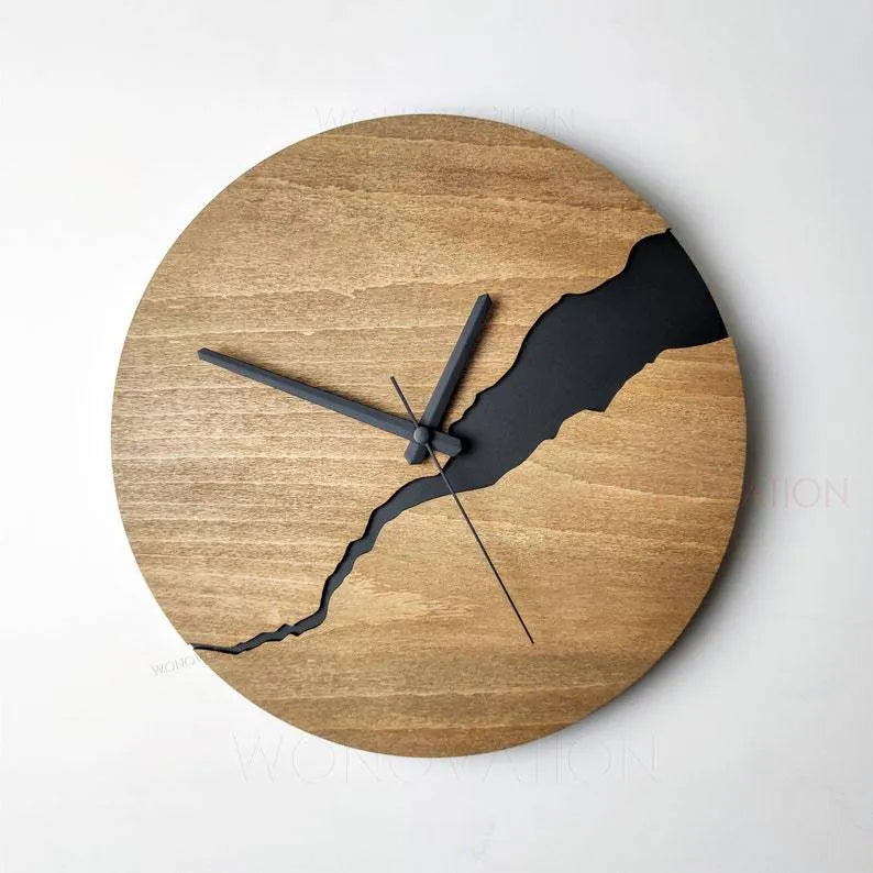 Modern wooden wall clock with a creative crack style design on its face.
