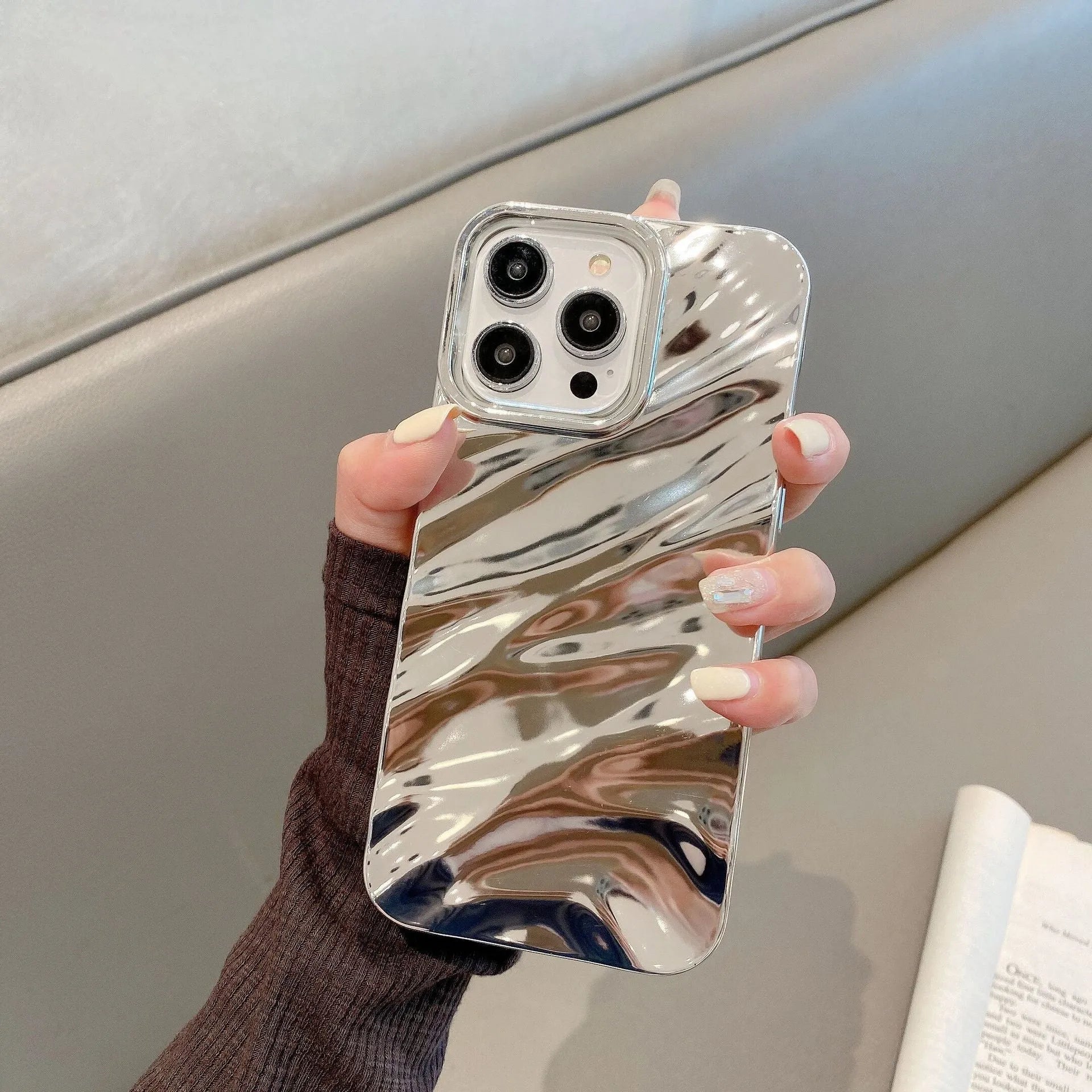Soft wave-patterned TPU phone case for Apple iPhone 17 models in burgundy colour.