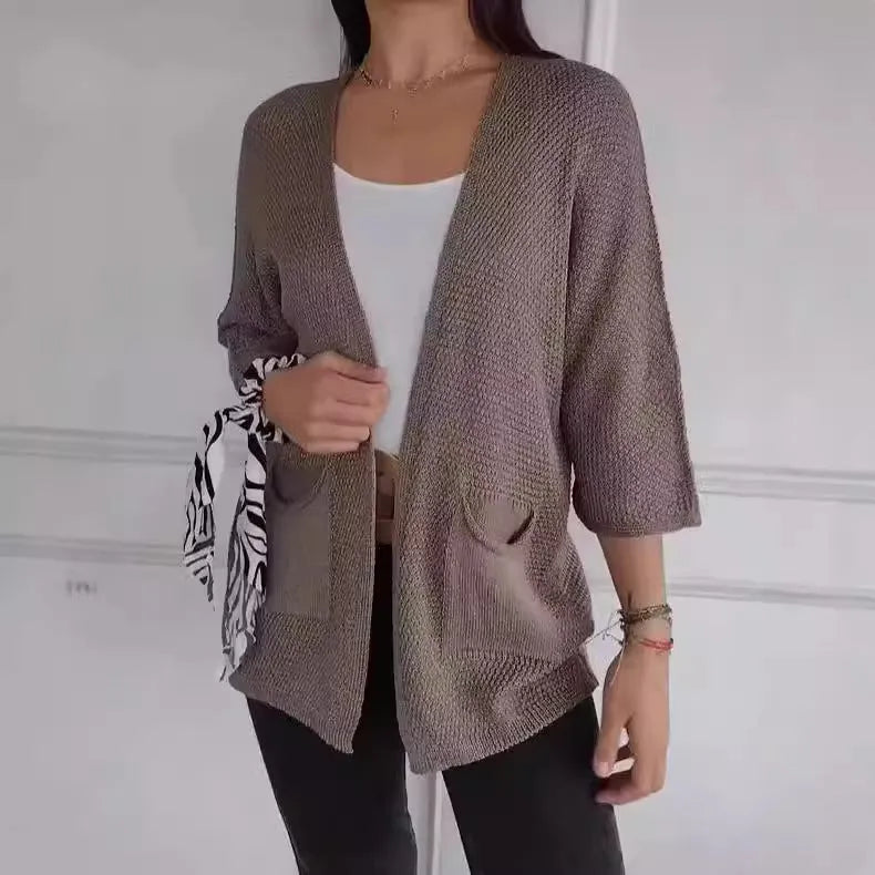 Women's waffle-textured cardigan coat in army green with nine-quarter sleeves and front pockets.