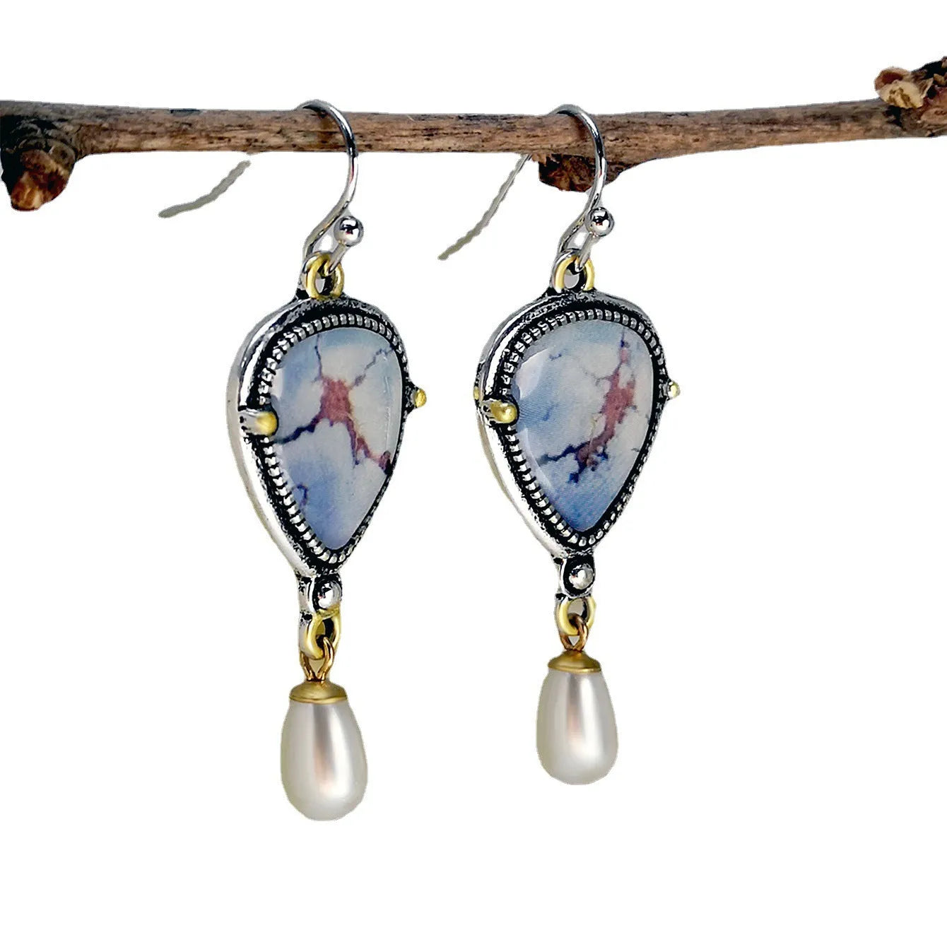 Retro blue bohemian drop earrings with synthetic opal and white pearl on metal.