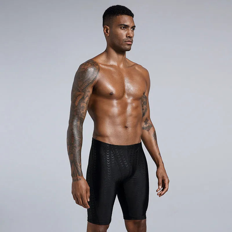 Men's solid colour swimming trunks in waterproof shark skin polyester fabric