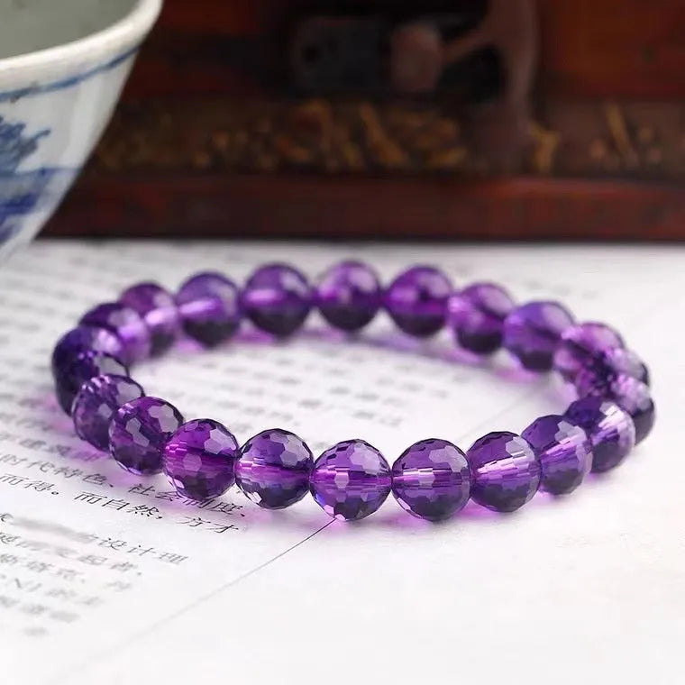 Handmade unisex bracelet with 128-faceted crystal beads and a decorative charm, available in multiple bead sizes.