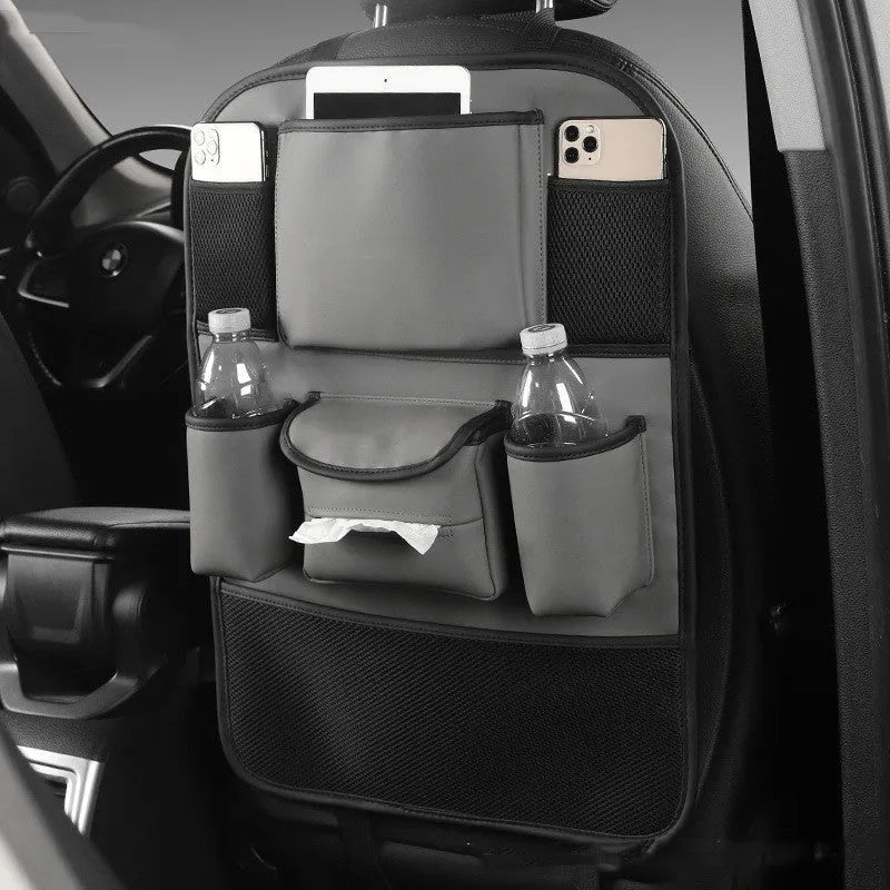 Leather car seat back storage bag hanging from a headrest, shown in grey colour.