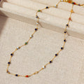 Gold titanium steel women's necklace with natural stone pendant on O-ring chain.