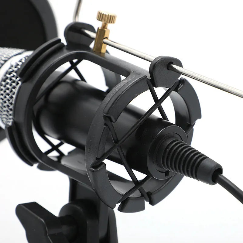Black condenser microphone on stand with 3.5mm and USB cables for mobile and computer recording
