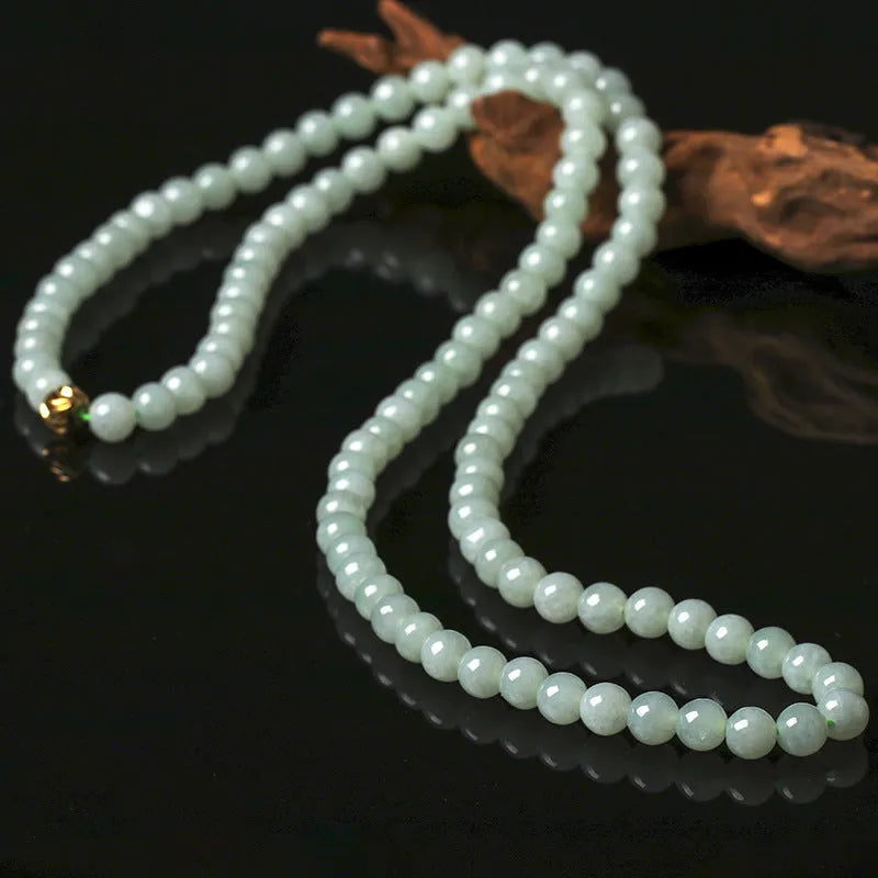 Natural A-level jade bead necklace with white and green round beads on an adjustable chain.