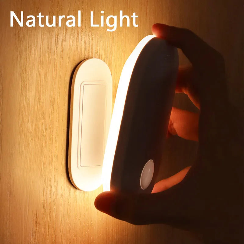 White magnetic human induction night light showing back lighting ring and compact 108x60x22mm size.