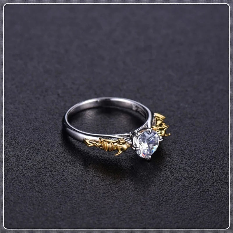 A black gold finished crown motif ring on a copper base, shown on a finger, with detailed modelling visible.