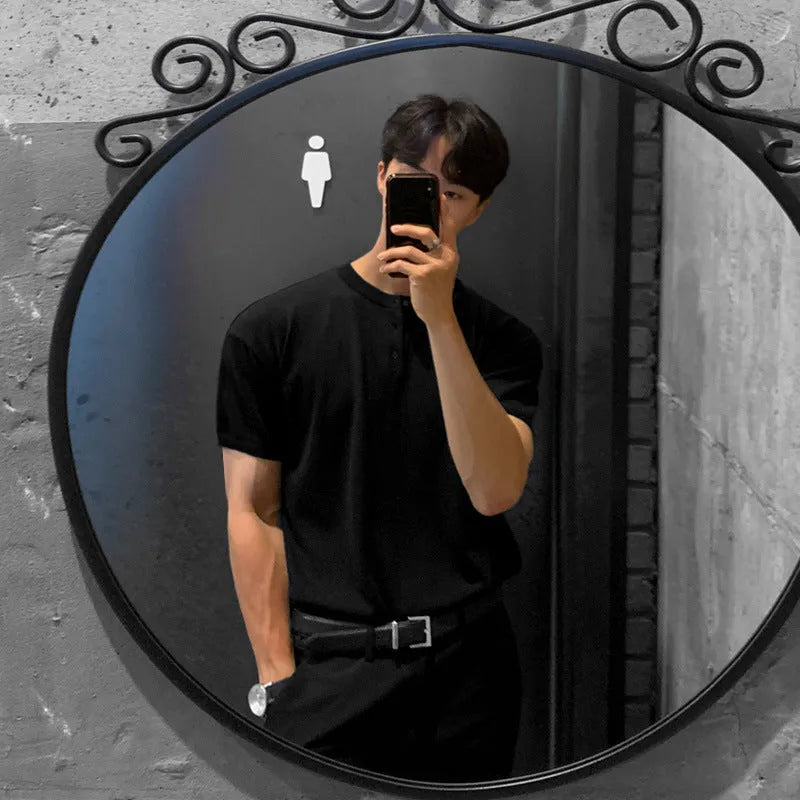 Men's black slim-fit short-sleeved ice silk knitted shirt laid flat, showing pullover style and thin fabric texture