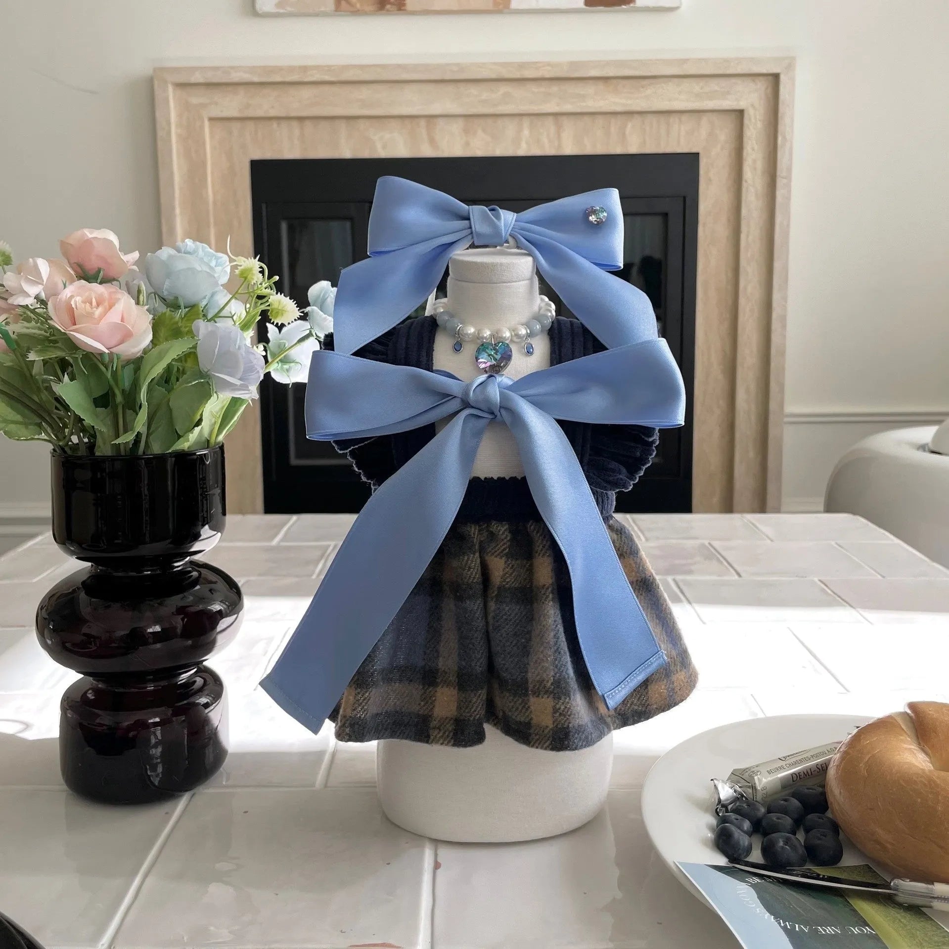 Blue adjustable princess bow hair band on a dog, showing the jacquard ribbon material and tension adjustment.