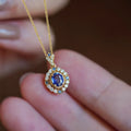 Yellow gold royal style necklace with inlaid zircon pendant on a copper box chain.