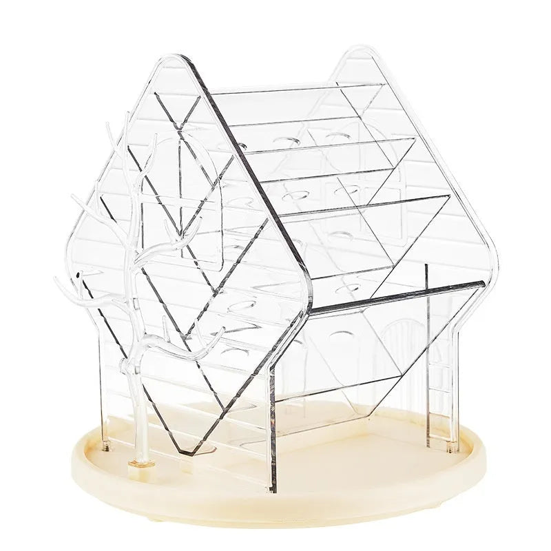 Clear and amber gold rotating plastic cosmetics storage box on a flat surface