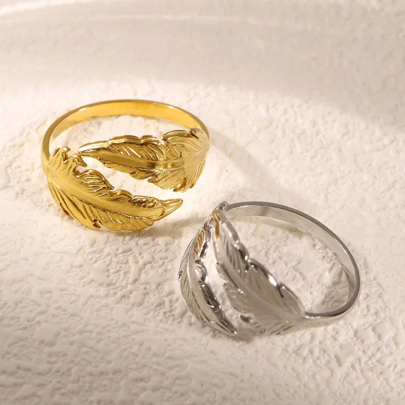 Women's adjustable feather design ring in gold and silver titanium steel options