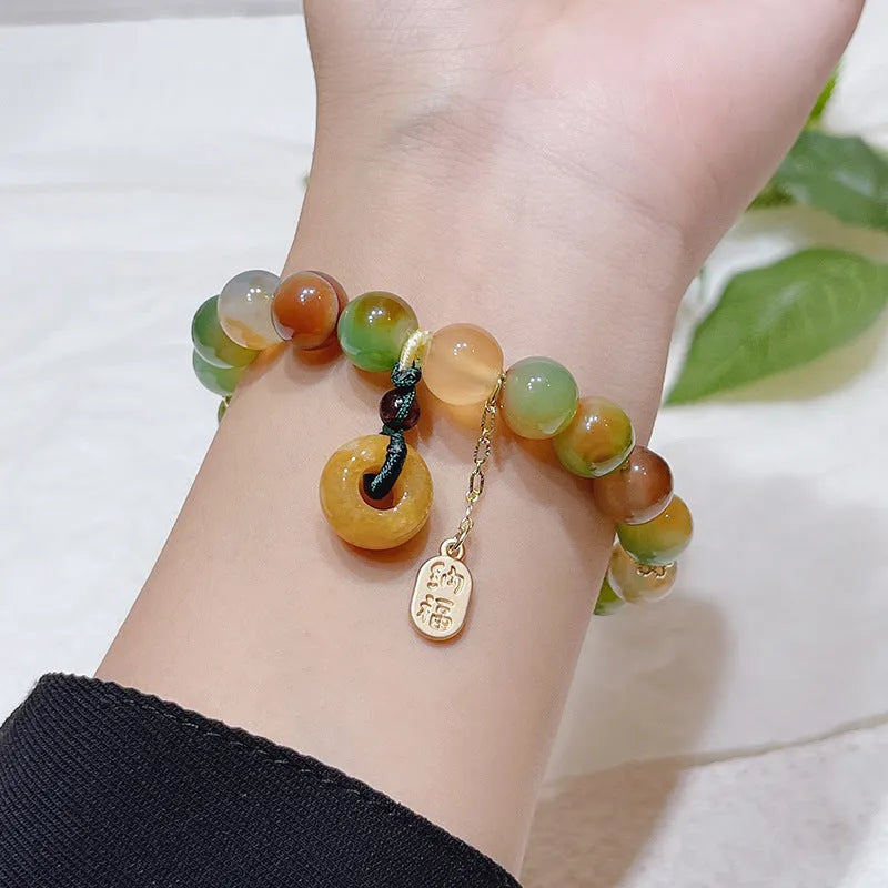 Yellow Lutong agate bracelet with peacock agate and topaz elements, peace buckle clasp, 1cm width women's jewellery