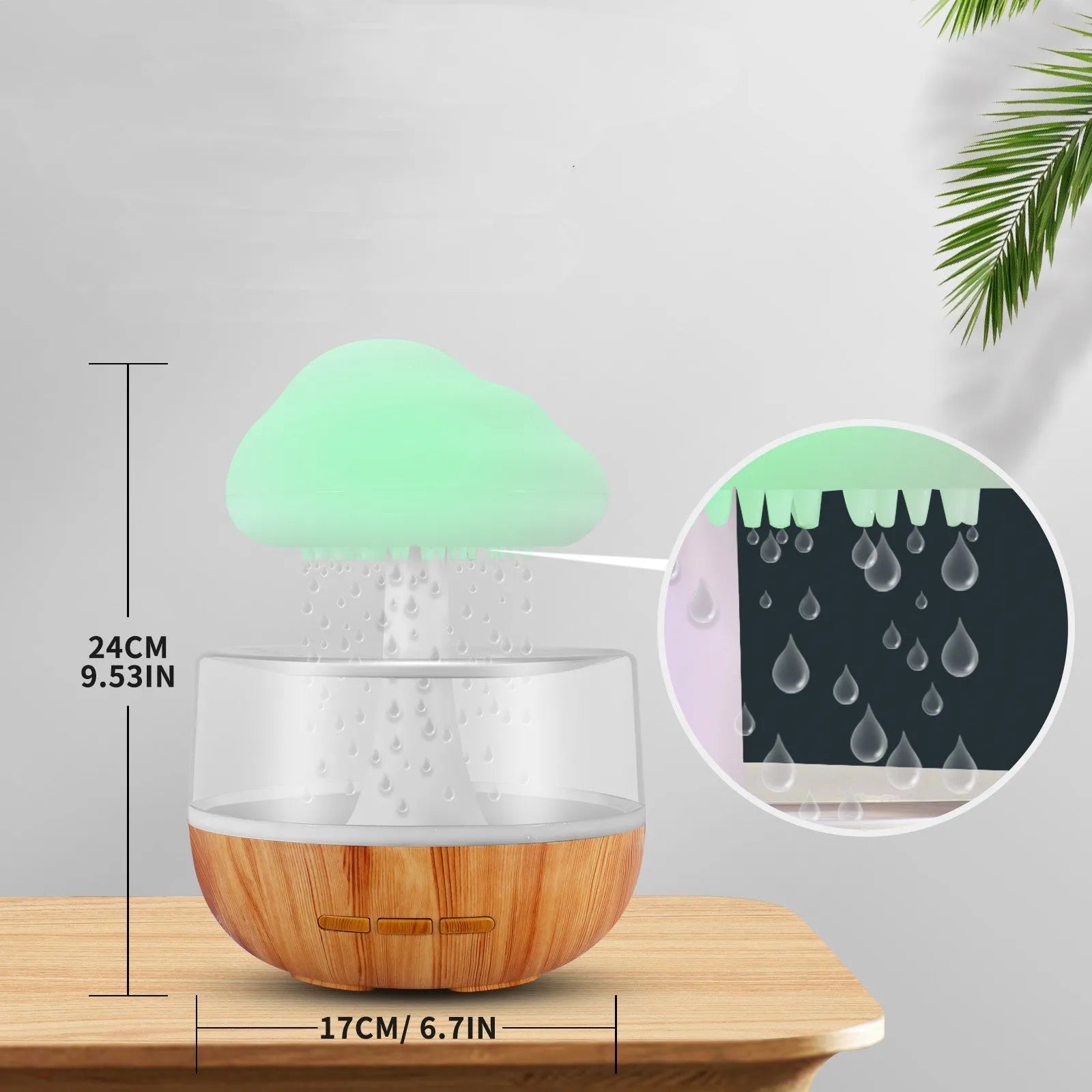 White cloud-shaped humidifier and essential oil diffuser with coloured mood light on.
