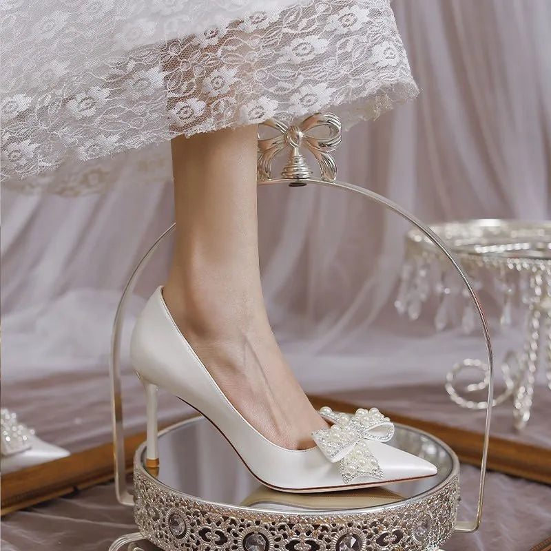 Women's stiletto heel bride wedding dress shoes in milky white with pointed toe and low top