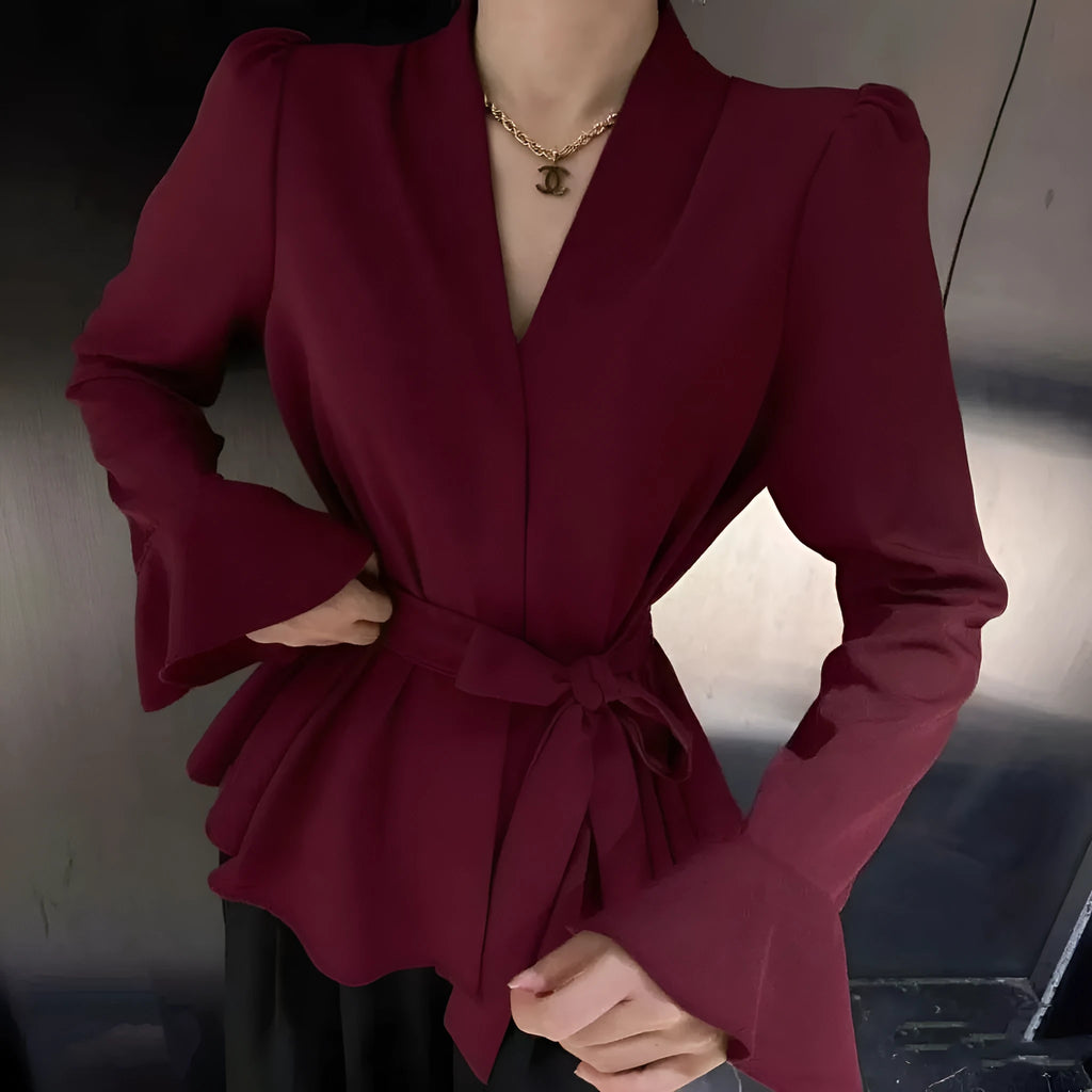 Women's black French-style shirt with an irregular collar and long bell sleeves, tied at the front.