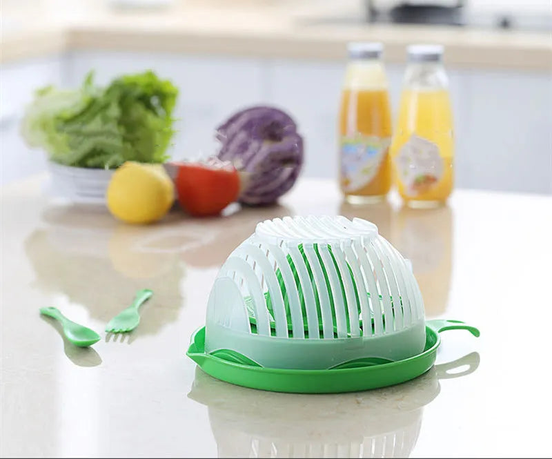 Blue salad cutter bowl showing removable cutting lid placed on a base with a raised rim.