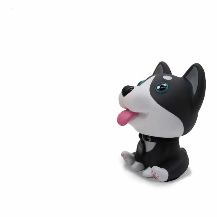 PVC nodding dog bobblehead in khaki, 9.3 cm tall, on a car dashboard