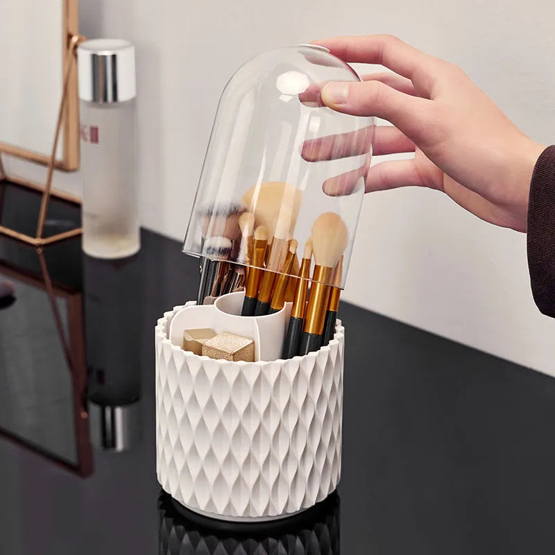 White rotating transparent makeup brush holder with dustproof lid on desktop