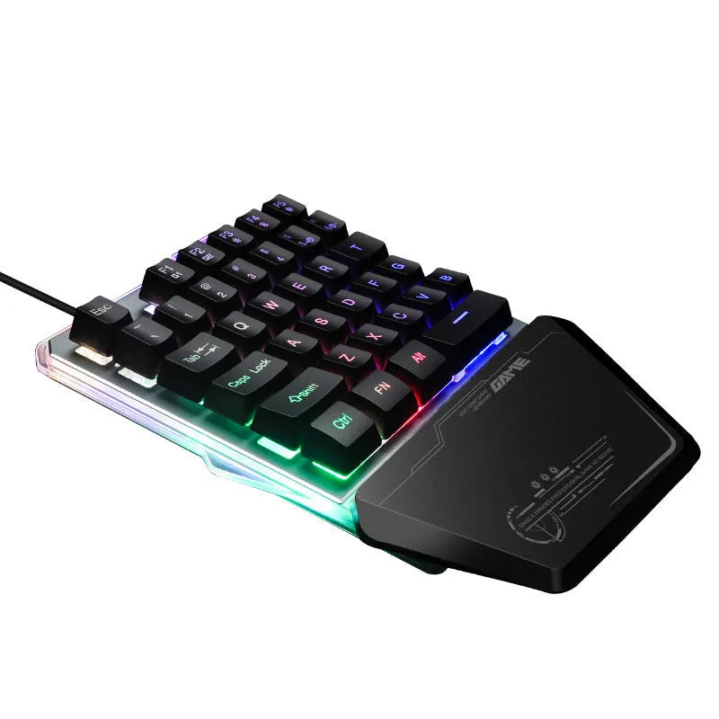 Black Robotic G40 Flow one-handed mechanical keyboard with RGB backlit keys on a desk.