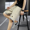 Casual polyester beach shorts with micro elasticity in Korean loose style, available in green, black, khaki and blue colours