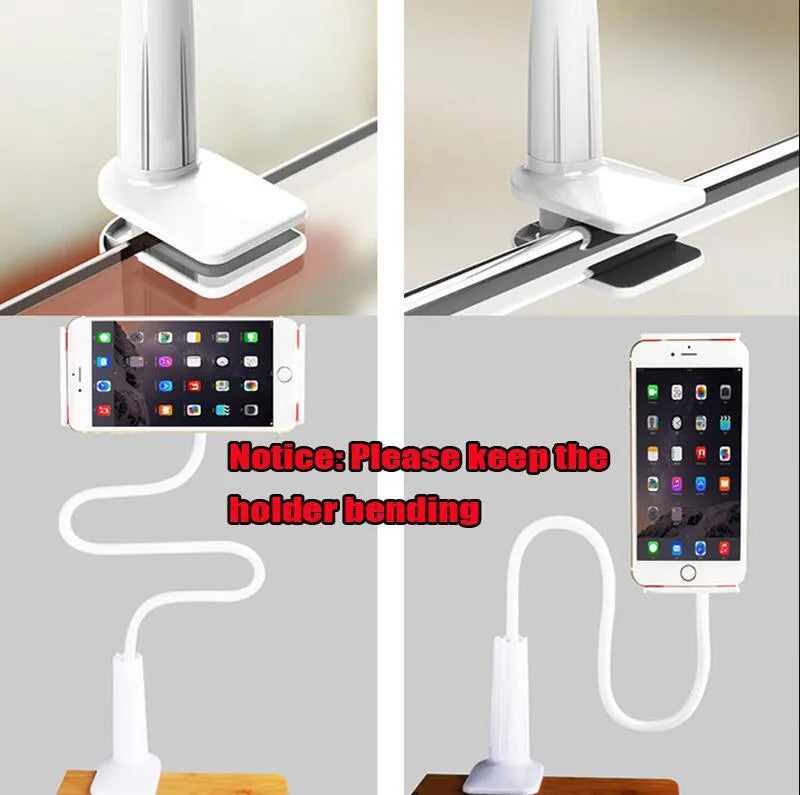 Black oversize flat panel phone holder with a long adjustable arm on a wooden table.
