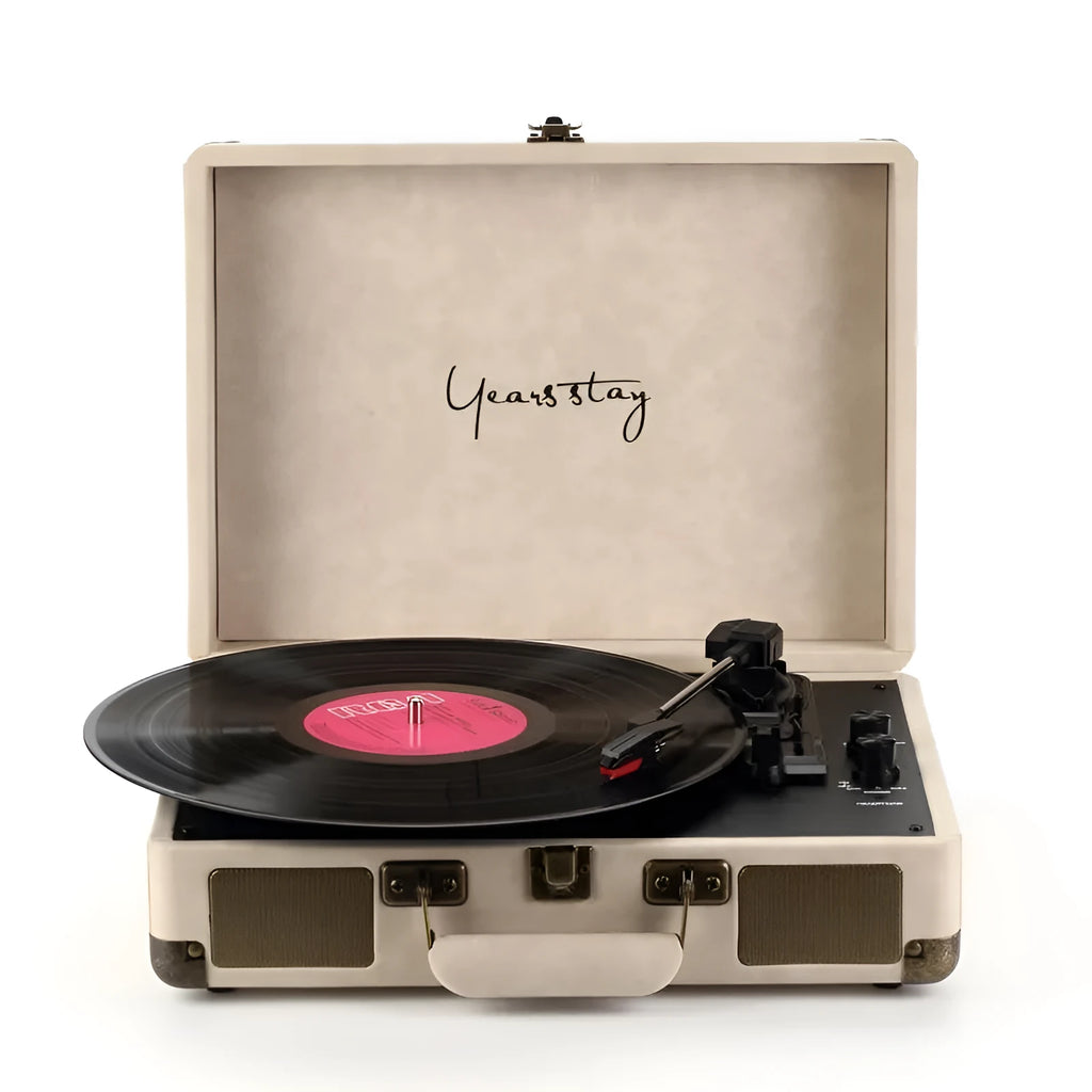 Portable Bluetooth phonograph turntable in a leather case, showing colour options.